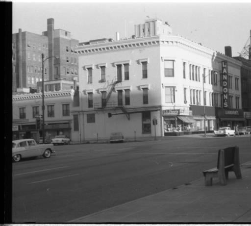 Vintage image of exterior of Landon's, street and vintage cars